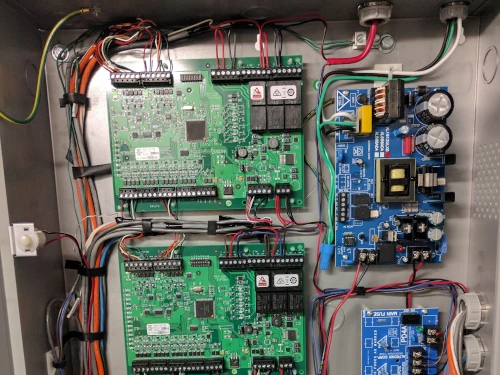 Commercial Electrical Access Control System installation with neatly routed wires and control boards